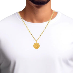 Man wearing a small gold Saint Christopher medal on a chain