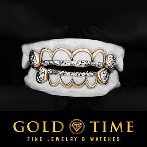 12 piece two-tone grillz set on a mold with yellow gold open window frames, white trillion diamond-cut tips and box-cut canines, Gold Time logo
