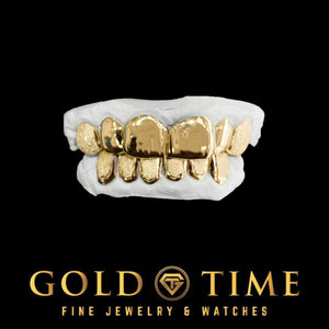 Yellow gold 12 piece diamond dust grillz with perm cuts on top and bottom dental molds