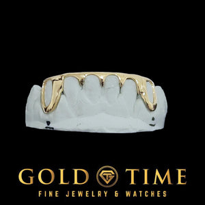 Custom 6 piece bottom grillz in yellow gold with open face canines and spiked center tips on a dental mold