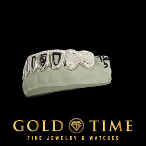 Side view of the open face trillion tip grillz set on a dental mold