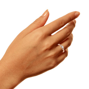 Hand wearing the 14K rose gold diamond engagement ring
