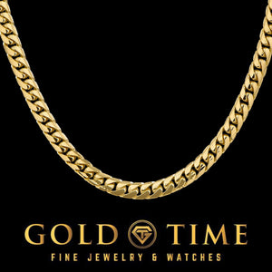 Close-up of a polished yellow gold 5.5mm Miami Cuban chain