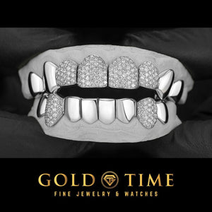 Custom 16 piece white metal grillz on a mold with iced moissanite honeycomb on the four top front teeth and two bottom canines, solid perm cut caps on the rest, Gold Time logo