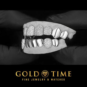 Angled view of the 16 piece moissanite honeycomb and perm cut grillz set on a dental mold