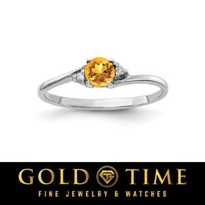 14k white gold bypass ring with a round golden yellow gemstone and diamond accents