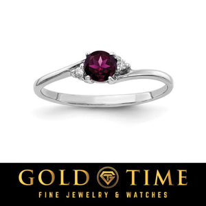 14k white gold bypass ring with a round deep purple red gemstone and diamond accents