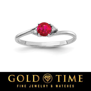 14k white gold bypass ring with a round bright red gemstone and diamond accents