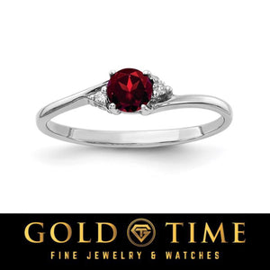 14k white gold bypass ring with a round dark red gemstone and diamond accents