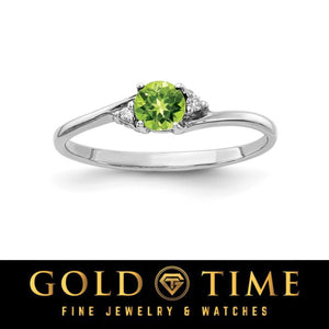 14k white gold bypass ring with a round olive green gemstone and diamond accents
