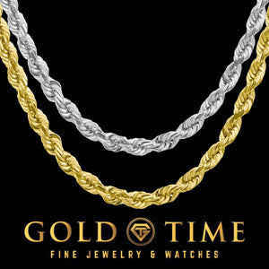 Yellow gold and white gold 5.5mm diamond cut rope chains laid side by side on a black background