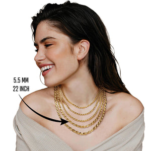 Woman wearing a 22 inch 5.5mm gold rope chain layered with other necklaces