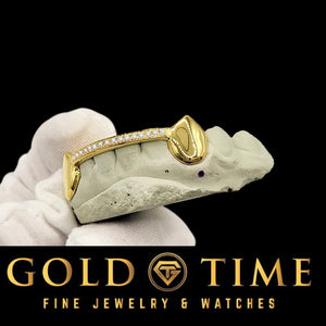 Side view of custom yellow gold fang grillz with moissanite tip bar