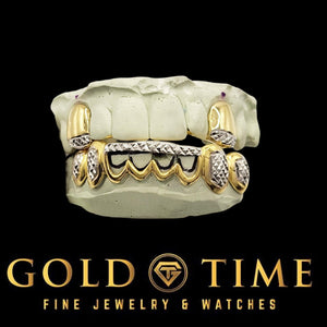 Two-tone gold 10 piece grillz with open windows and diamond-cut trillion tips, front view on molds