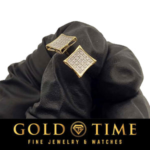 Yellow gold kite square diamond studs shown on black fabric