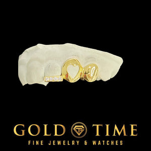 Custom yellow gold 3 piece grillz with solid cap, open heart cut-out, and moissanite tip