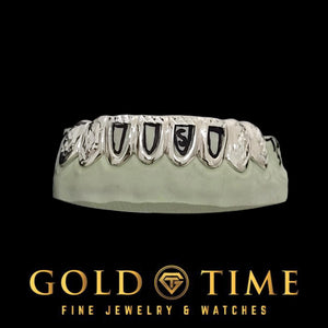Front view of the eight piece open face grillz showing trillion cut tips across the row