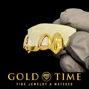 Gold grillz held by a gloved hand with 'Gold Time' branding.