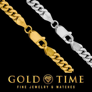 Close up of yellow gold and white gold Miami Cuban chains with lobster clasps