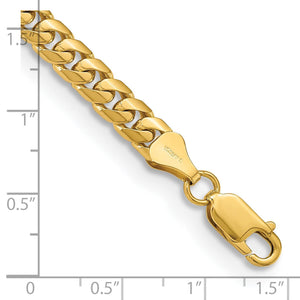 Yellow gold 5.5mm Miami Cuban chain with lobster clasp next to a ruler for scale