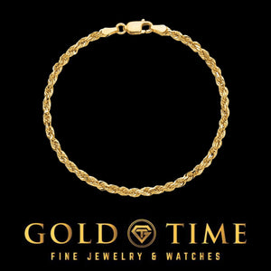 Yellow gold 3mm rope bracelet laid in a circle on a black background