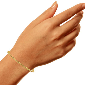 Yellow gold 3mm rope bracelet worn on a wrist
