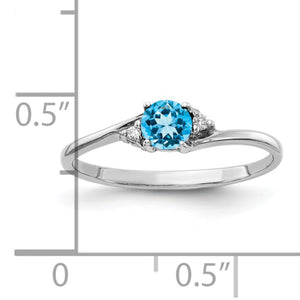 14k white gold gemstone ring measured against a ruler, the center stone just under a quarter inch across