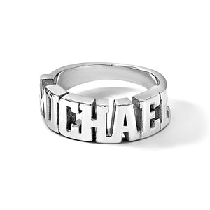 Sterling silver personalized name ring with bold block letters, angled view