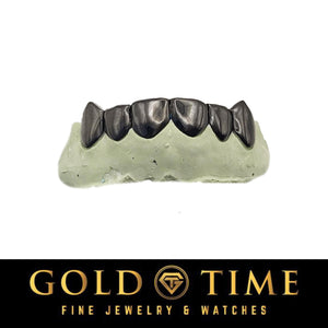 black grill with fangs with Gold Time Fine Jewelry & Watches logo at the bottom.