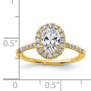 Yellow gold oval halo ring next to a ruler, about half an inch across the top