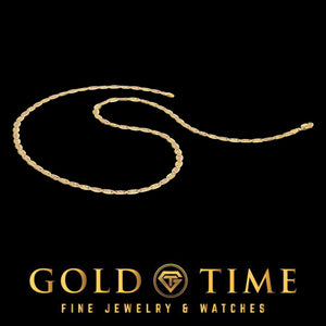14k gold Valentino chain laid in a loose curve on a black background