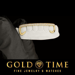 6 piece yellow gold open face hooks grillz with a moissanite tip row, held on a dental mold