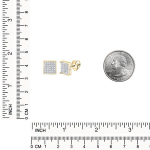 Yellow gold square cluster studs beside a quarter with inch and centimeter rulers