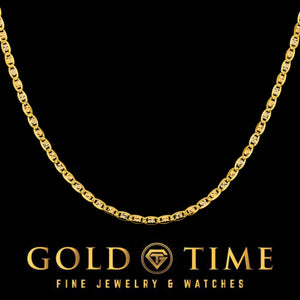 14k tri-color gold Valentino chain coiled on a black background