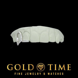 Side view of the moissanite open face fang and tip grillz on a dental mold