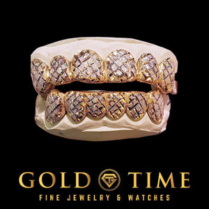Two-tone 12 piece grillz set with yellow frames and white trillion cut diamond dust faces