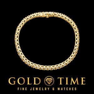 Front view of a yellow gold diamond tennis bracelet in a round shape on black