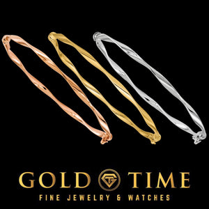Three twisted hinged bangles in rose, yellow, and white gold, shown on black