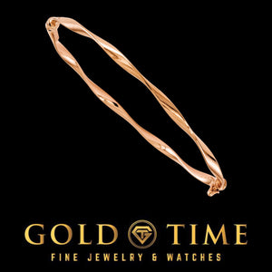Rose gold twisted hinged bangle on black