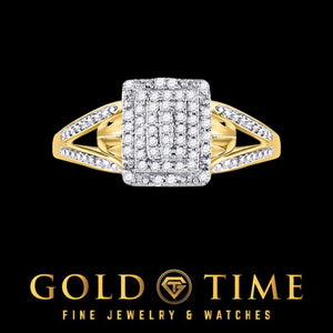 Yellow gold diamond cluster ring lying flat, showing the split shank shoulders