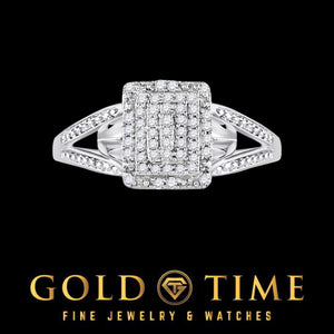 White gold diamond cluster ring lying flat, showing the split shank shoulders