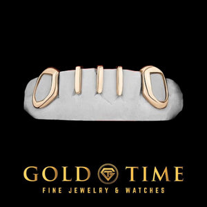 Rose gold five piece grill with open face canines and three slim gap bars on a dental mold