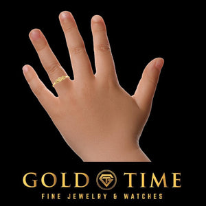 Small hand wearing the yellow gold flower ring