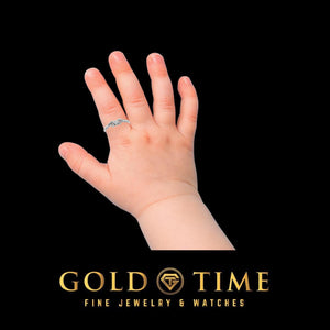 White gold heart and leaf ring worn on a little one's hand