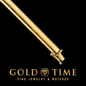 Close-up of the box clasp with safety latch on a yellow gold omega necklace