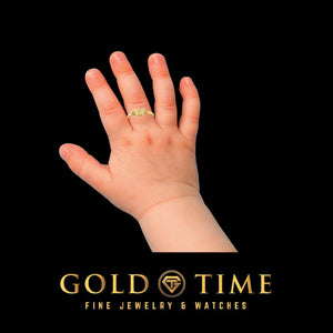 Yellow gold baby butterfly ring worn on a baby's finger
