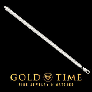 Slim sterling silver omega bracelet laid straight