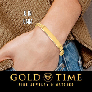 Woman wearing an 8 inch 6mm yellow solid gold curb Cuban link ID bracelet