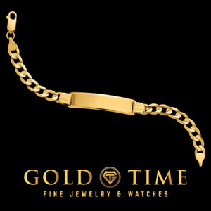 Yellow solid gold curb Cuban link ID bracelet laid flat