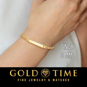 Woman wearing a 7 inch 3mm yellow solid gold curb Cuban link ID bracelet